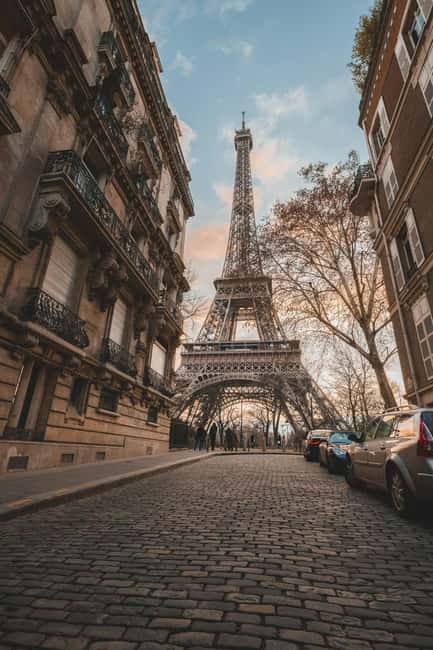 Eiffel Tower Reserved Access with Photoshoot stops - Meeting by the Seine at 7 rue de la Manutention