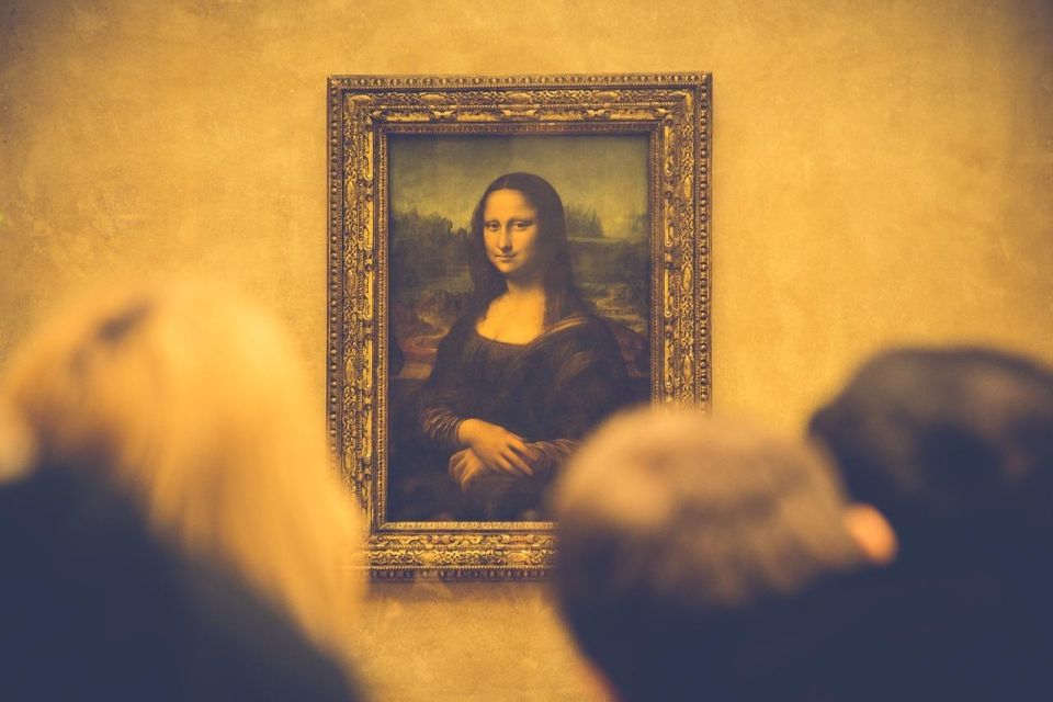 Louvre Museum Skip-the-Line Guided Tour - Meeting at 8 Pl. du Carrousel: find the orange ExperienceFirst sign
