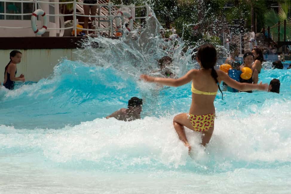 Paris: Aquaboulevard Water Park Entrance Ticket - Relax zones: jacuzzis and a sandy beach with straw huts