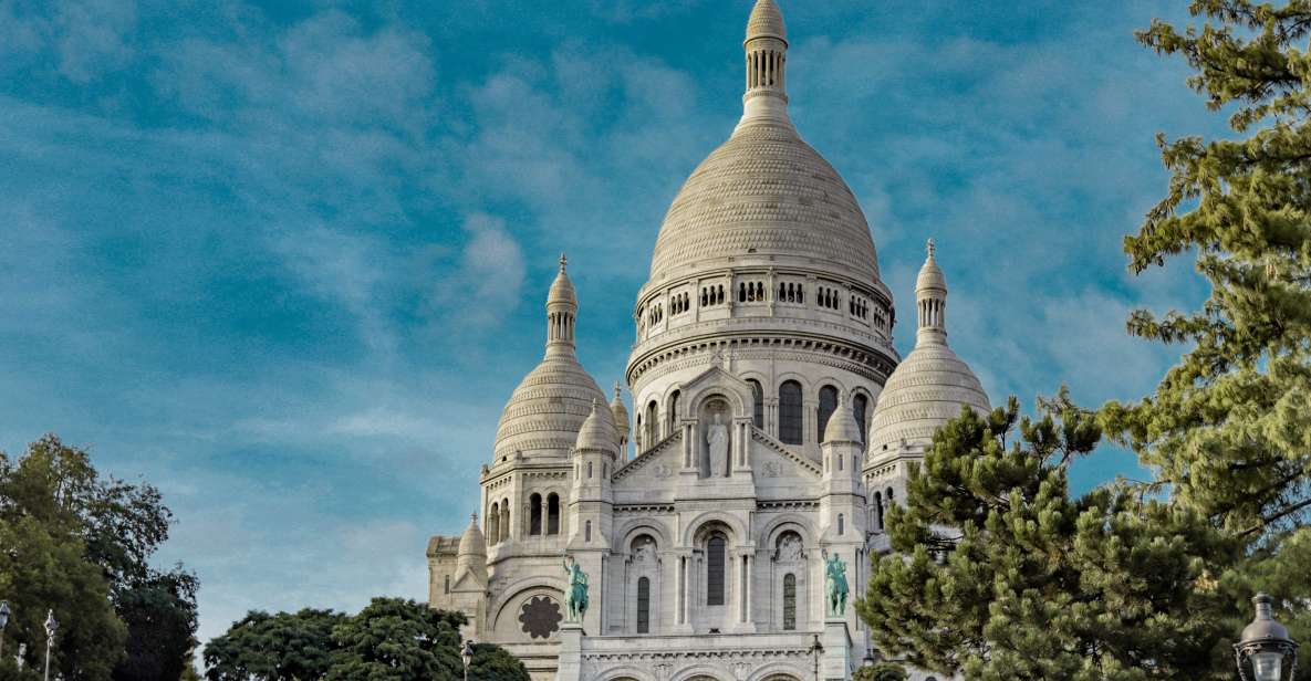 Paris: Charms of Montmartre Guided Walking Tour - Starting at the Moulin Rouge: stories that set the tone fast