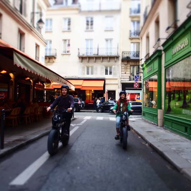 Paris: City Highlights Private Electric Bike Tour with video - Place des Vosges: classic Paris geometry from the saddle