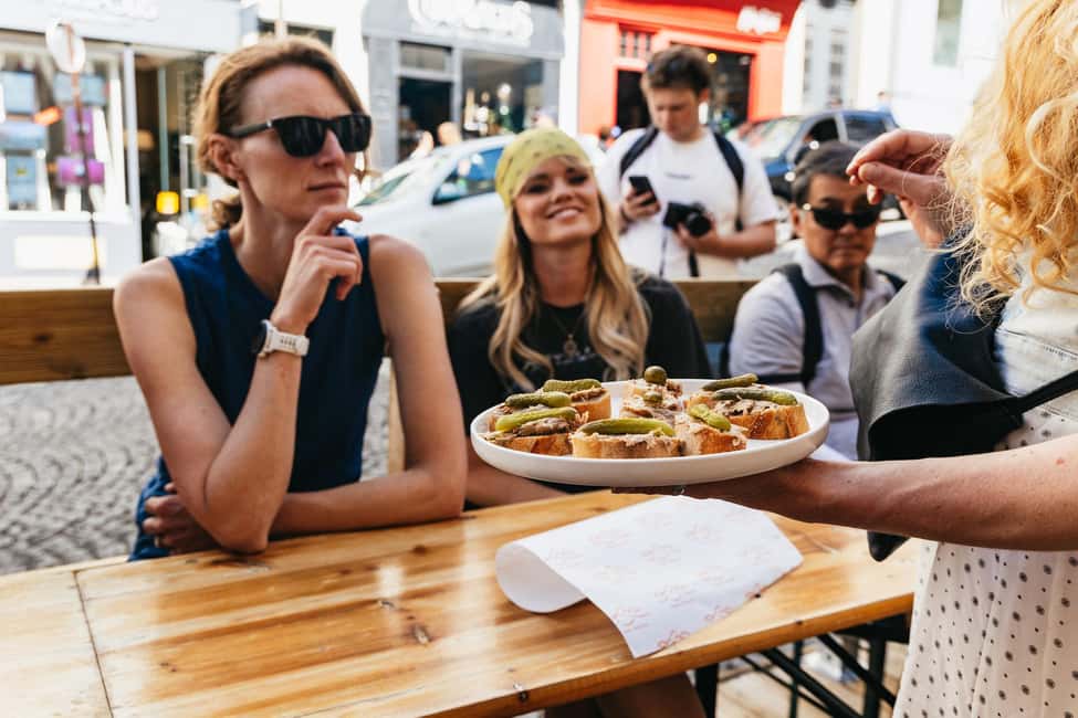Paris: Montmartre Cheese, Wine & Pastry Guided Walking Tour - Place du Tertre: artists, painters’ square energy, and real café life