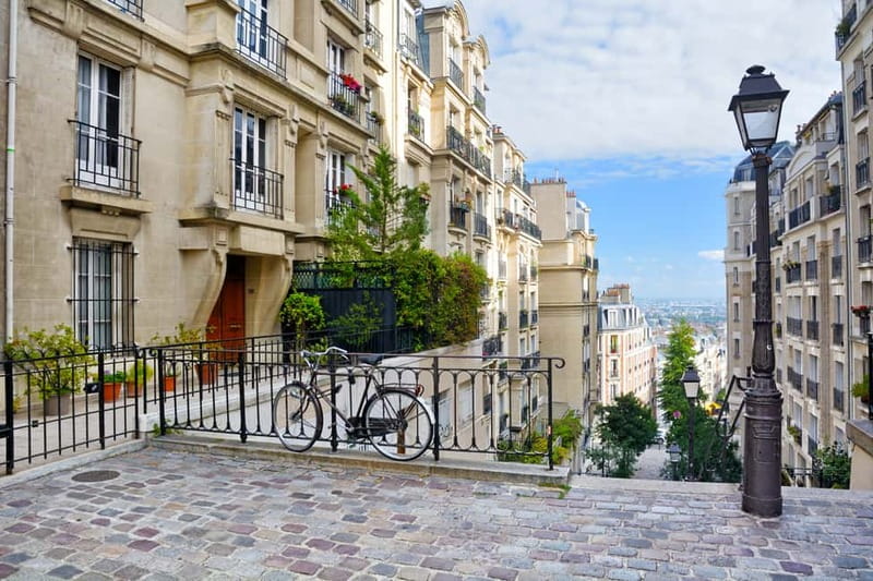 Paris: Montmartre Hidden Gems and Highlights Walking Tour - Moulin de la Galette and Rue des Abbesses: Art Meets Real Street Corners