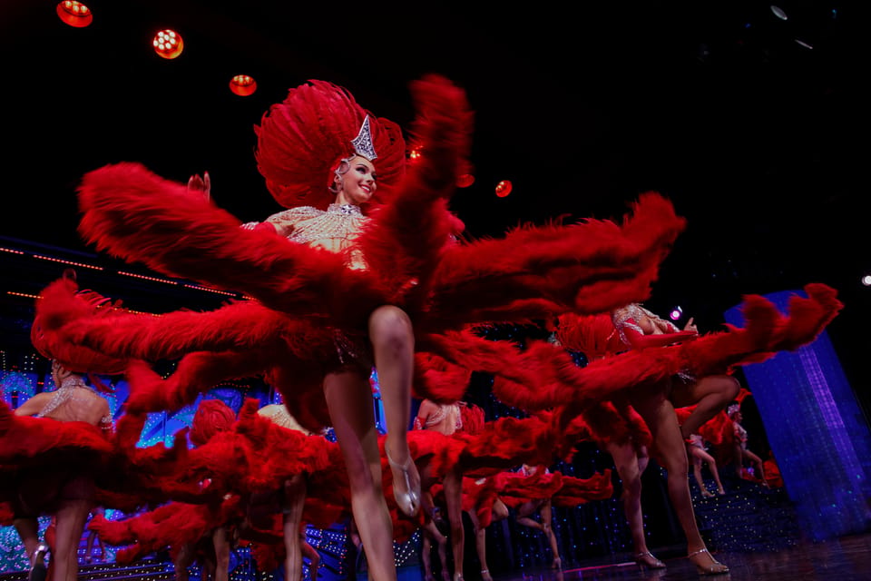 Paris: Moulin Rouge Show with Champagne and Drop-Off Service - Inside the Theatre: Tickets, Tables, and the Champagne Moment