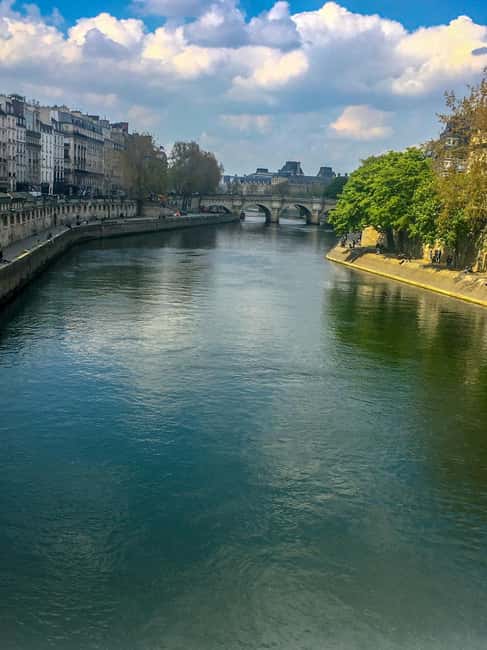 Paris: Notre Dame Exteriors and Ile de la Cité Walking Tour - Saint Michel Fountain: Photo Backdrop Plus a Saint-Story
