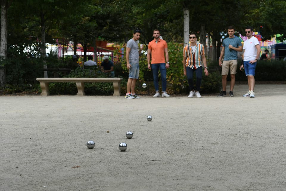 Paris: Pre-Dinner Drinks with Petanque Game (Bocce Ball) - Place de la Bastille: The Calm Backdrop for Friendly Competition